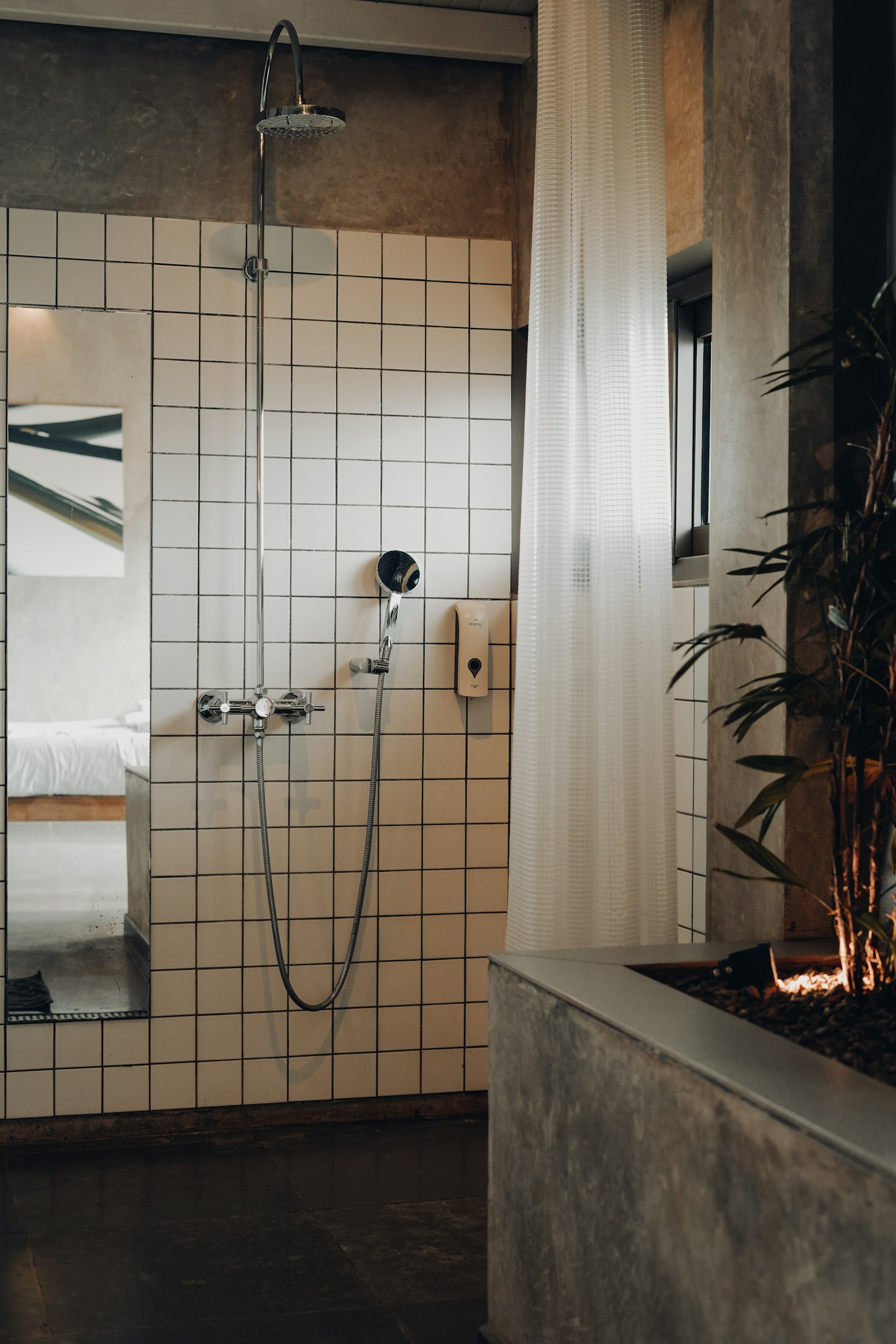 A tiled shower space illustrating the use of hot water